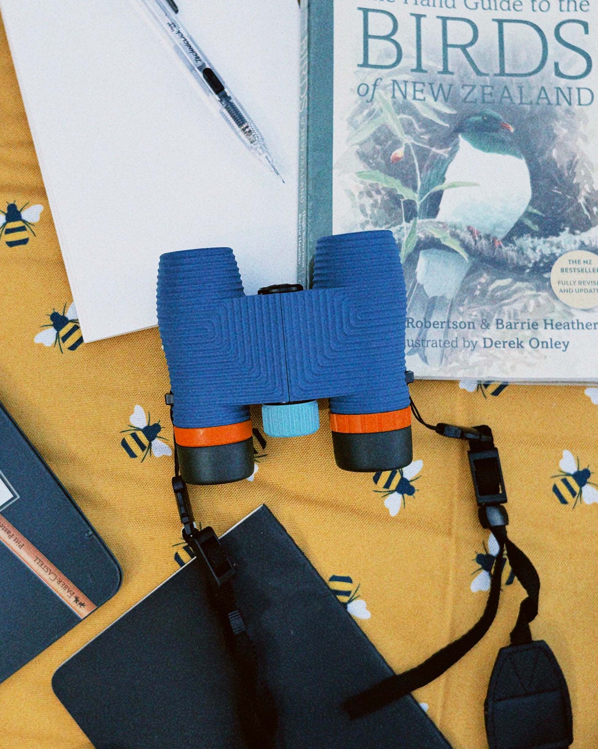 Binoculars and field guides prepared for an outing